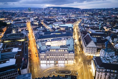 An aerial view shows the headquarters of the Swiss banks Credit Suisse, center, and UBS, left, at Paradeplatz in Zurich, Switzerland on Sunday March 19, 2023. (KEYSTONE/Michael Buholzer).