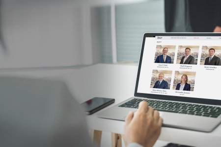 Businesswoman in business meeting using laptop computer proficiently at office for marketing data analysis . Corporate business team collaboration concept .