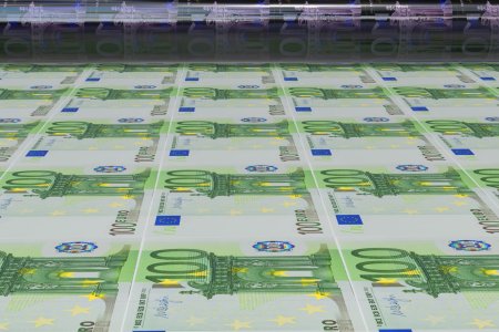 Business success, finance, banking, accounting and making money concept: printing 100 Euro money paper cash banknotes on print machine in typography