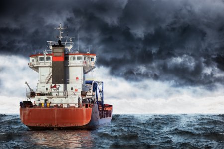 Cargo ship at sea during a storm.