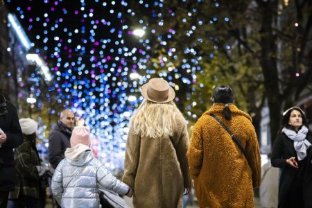 People gather to watch the Christmas illumination "Lucy" as it is switched on the first time of the year at the Bahnhofstrasse in Zurich, Switzerland on Thursday, November 24, 2022. (KEYSTONE/Michael Buholzer)