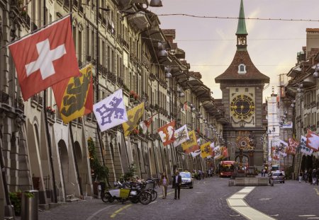 Kramgasse (street) in the medieval old city of Bern in Switzerland, with the 13th century Zytglogge clock tower at the end of the street.