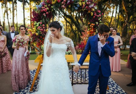 Bride and groom crying in the altar