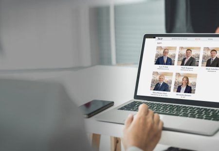 Businesswoman in business meeting using laptop computer proficiently at office for marketing data analysis . Corporate business team collaboration concept .