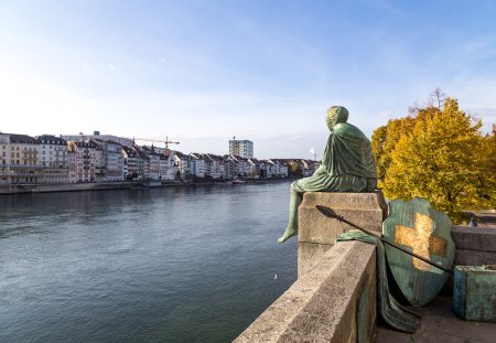 Basel, Switzerland - October 24, 2016: The Helvetia statue at the Rhine river by artist Bettina Eichin. The statue represents the female personification of Switzerland.
