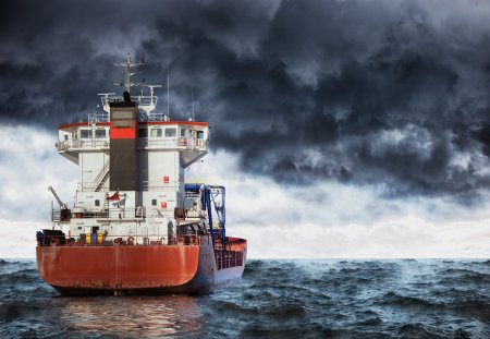 Cargo ship at sea during a storm.